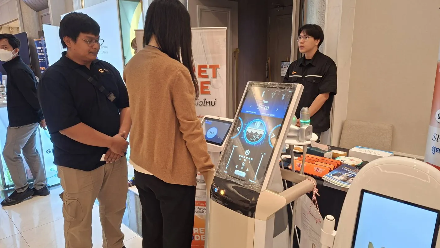 A doctor trying a device at the booth