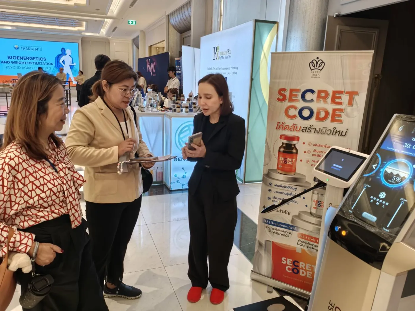Discussing devices at the booth